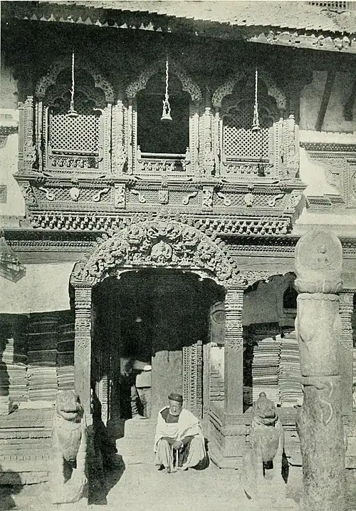 Black and white photograph of the entrance to a temple in Katmandu.