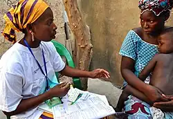 Delivery of malaria treatment by community health worker in Djénébougou, Mali. October 2013.