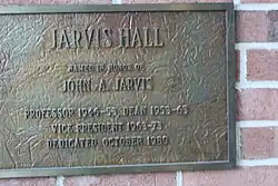 This is a picture of the plaque dedicated to John A. Jarvis. He was a professor, dean, and vice president of UW-Stout. The plaque is located in Jarvis Hall in Menomonie, WI.