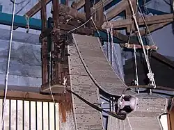 The Jacquard loom was developed in 1801. Note the wooden punch cards.