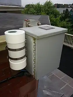 The sky brightness meter (white cylinder) and sky camera (grey box)